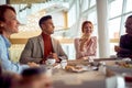 group of business people in restaurant lunch and talks Royalty Free Stock Photo