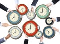 Group of Business People's Hands Holding Clocks
