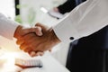 Group of business people shaking hands after finishing up new business contract Royalty Free Stock Photo