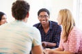 Group Of Business People Sitting On Chairs Having Meeting Royalty Free Stock Photo