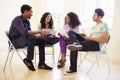 Group Of Business People Sitting On Chairs Having Meeting Royalty Free Stock Photo