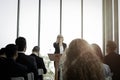 Group of business people sitting on conference together listening to the speaker giving a speech in the meeting room seminar  The Royalty Free Stock Photo