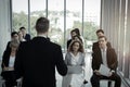 Group of business people sitting on conference together listening to the speaker giving a speech in the meeting room seminar  The Royalty Free Stock Photo