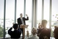 Group of business people sitting on conference together listening to the speaker giving a speech in the meeting room seminar Royalty Free Stock Photo