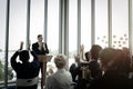 Group of business people sitting on conference together listening to the speaker giving a speech in the meeting room seminar Royalty Free Stock Photo