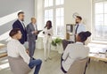 Group of business people in smart casual wear having brainstorm meeting Royalty Free Stock Photo