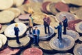 Group of business people standing on euro money stack