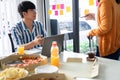 Group of business people talking about project and prepare pizza and potato chips for having lunch in corporate together in office Royalty Free Stock Photo