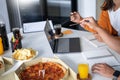 Group of business people talking about project and prepare pizza and potato chips for having lunch in corporate together in office Royalty Free Stock Photo