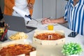 Group of business people talking about project and prepare pizza and potato chips for having lunch in corporate together in office Royalty Free Stock Photo