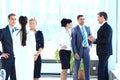 Group of business people talking,standing in the lobby of the office. Royalty Free Stock Photo