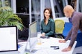 Group of business people using computer and working together in a modern office