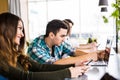 Group of business people using digital devices. Team of people working at their table in devices in modern office. Concentrate man Royalty Free Stock Photo