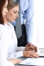 Group of business people using laptop computer while standing in office. Meeting and teamwork concept Royalty Free Stock Photo