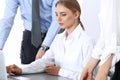 Group of business people using laptop computer while standing in office. Meeting and teamwork concept Royalty Free Stock Photo