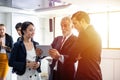 Group of business people using tablets for meetings in conference rooms Royalty Free Stock Photo