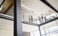 Group of business people walking and taking at stairs in an office Royalty Free Stock Photo