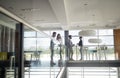 Group of business people walking and taking at stairs in an office Royalty Free Stock Photo