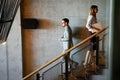 Group of business people walking and taking stairs in an office building Royalty Free Stock Photo