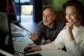 Group of business people working together in the office in late evening Royalty Free Stock Photo