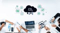 Business professionals analyzing carbon dioxide emissions data, using technology and digital devices for environmental Royalty Free Stock Photo