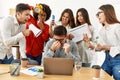 Group of business workers screaming to stressed partner at the office Royalty Free Stock Photo