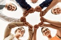 Group of business workers smiling happy bump fists standing at the office Royalty Free Stock Photo