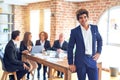 Group of business workers smiling happy and confident working together in a meeting Royalty Free Stock Photo