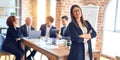 Group of business workers smiling happy and confident working together in a meeting Royalty Free Stock Photo