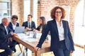 Group of business workers smiling happy and confident working together in a meeting Royalty Free Stock Photo