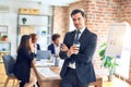 Group of business workers smiling happy and confident working together in a meeting Royalty Free Stock Photo