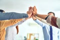 Group of business workers standing with hands together highing five at the office Royalty Free Stock Photo
