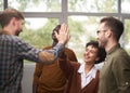 Businessman giving high five to his partner in office Royalty Free Stock Photo