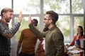 Businessman giving high five to his partner in office Royalty Free Stock Photo