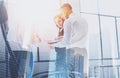 Group of businessmans on business meeting.Business team in working process.Double exposure,skyscraper building blurred Royalty Free Stock Photo