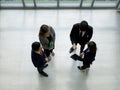 A group of businessmen discussing work in the hall of a modern office. People corporate business team concept. Top View Royalty Free Stock Photo