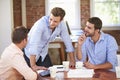 Group Of Businessmen Meeting To Discuss Ideas Royalty Free Stock Photo