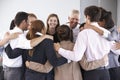 Group Of Businesspeople Bonding In Circle At Company Seminar Royalty Free Stock Photo