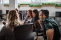 over shoulder shot of businesspeople discussing work during an office meeting Royalty Free Stock Photo