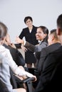 Group businesspeople, focus on woman in audience Royalty Free Stock Photo