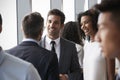 Group Of Businesspeople Having Informal Office Meeting