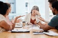 Group of businesspeople having a meeting together in a boardroom at work. Stressed mature caucasian businesswoman Royalty Free Stock Photo