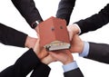 Group Of Businesspeople Holding Model House Royalty Free Stock Photo