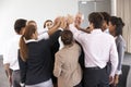 Group Of Businesspeople Joining Hands In Circle At Company Seminar Royalty Free Stock Photo