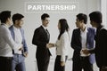 Group of businesspeople making handshake in office. partnership