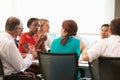 Group Of Businesspeople Meeting Around Boardroom Table Royalty Free Stock Photo