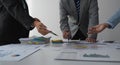 Group of businesspeople meeting around office table. Happy successful business team at desk, working on project Royalty Free Stock Photo