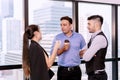 Group people standing and talking about work together on break relax time after hard work. Teamwork colleagues discuss Royalty Free Stock Photo