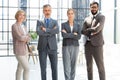 Group of businesspeople standing together in office. Royalty Free Stock Photo