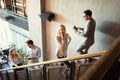 Group of businesspeople walking and taking stairs in an office building Royalty Free Stock Photo